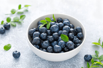 Blueberry with leaves in a bowl