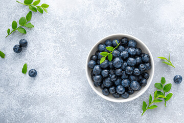 Blueberry with leaves in a bowl