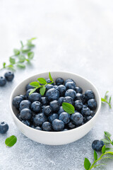 Blueberry with leaves in a bowl