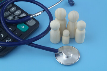 Cost of family medical insurance and medicine. Family people figures with calculator and stethoscope on blue background.
