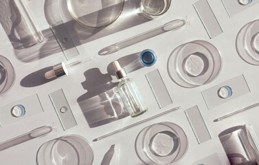serum in petri dishes on light background cosmetic research concept with place for text	
