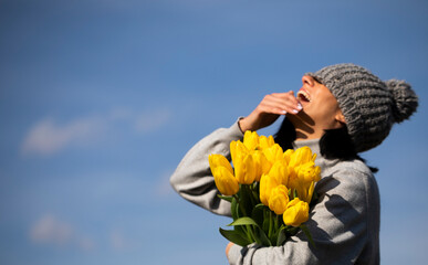 person with a bouquet of tulips. Mother day. Flowers. Tulips. Celebration. 