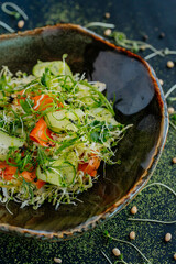 vegetable salad on a plate, black dining table, food for vegetarians, vegetarian dish
