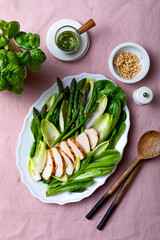 Green asparagus, grilled chicken, pesto, chicory, romen, green peas and pine nuts salad