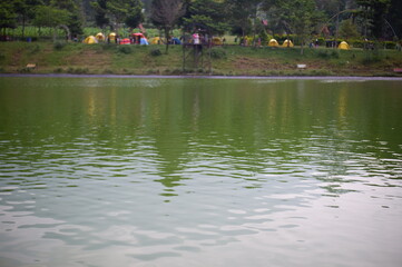 ducks in the lake, lake and mountains, or embung kledung lake arteficial or danau buatan in Temanggung, Indonesia