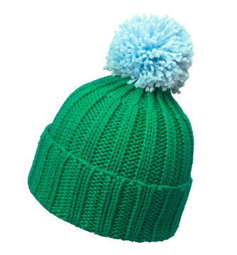 Green winter wool cap with light blue pom poms, isolated on white