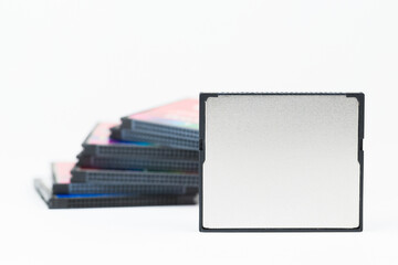 Multiple Compact flash memory cards on white background