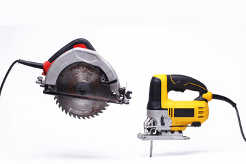 red circular saw and yellow jig saw isolated white background