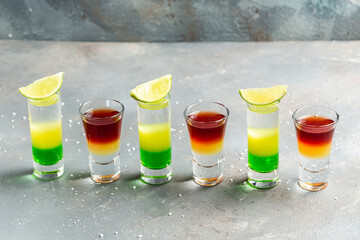 collection of colorful shots. Set of cocktails at the bar. alcoholic cocktail drinks shot with lime © Надія Коваль
