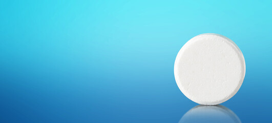 White pill with copy space on blue background