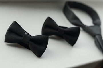 black bow tie on black background