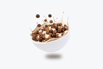 breakfast snacks fall into bowl with milk. File contains clipping path