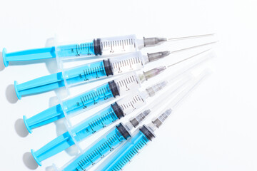 Fototapeta premium Disposable plastic syringe prepared for injection and vaccination in the hospital. The concept of medicine and health
