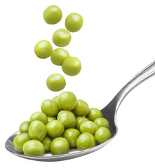 Green peas falling into metal spoon, isolated on white background