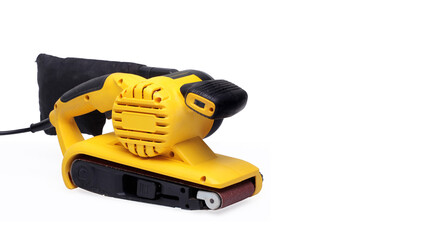 Fototapeta premium right facing yellow belt sander isolated white background