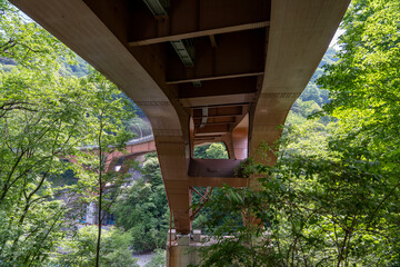 Long bend with  road bridge amazing technology in Japan. Mountain range dramatic Photography 