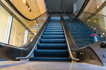Fototapeta premium Modern escalators in a shopping mall without people