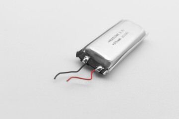 Lithium polymer battery on a white background. Compact small lithium battery for micro electronics....