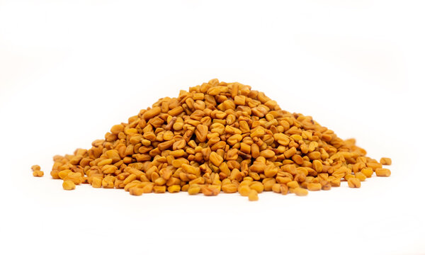 Fenugreek seeds, spices close-up as a background flat lay. Indian and Arabic spices for cooking. Medicinal herbs and condiment.
