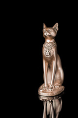 Egyptian cat statue isolated on black background