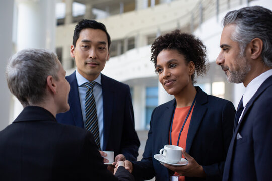 Business executives meeting at a networking event shaking hands
