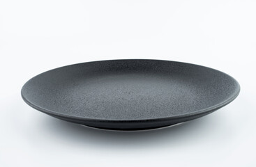 A black frosted plate dish on a white background
