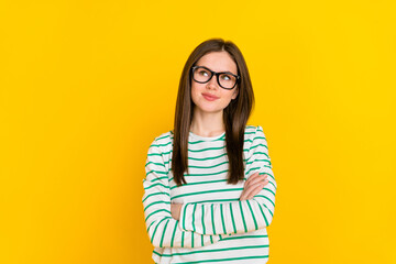 Photo of adorable interested businesswoman look blank space brainstorming isolated on yellow color background