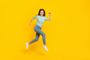 Fototapeta na wymiar Full length profile side photo of cheerful energetic good mood female running traveling isolated on yellow color background