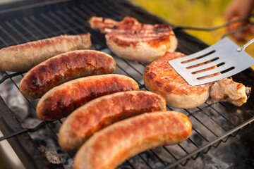 Crop cook grilling meat for picnic
