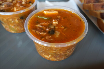 Meat soup in plastic containers