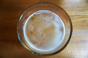 Glass of lager beer - top view