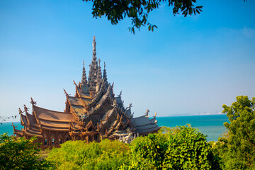 Wooden Temple in Pattaya. Traveling in Thailand. Wooden sculptures of beautiful carved patterns on...