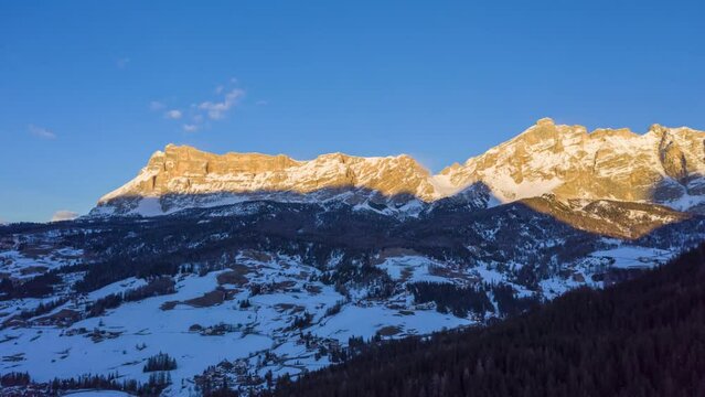 Sas dla Crusc Mountain. Dolomite Alps in Winter at Sunset. Badia, South Tyrol, Italy. Aerial Time Lapse, Hyper Lapse. Drone Flies Forward