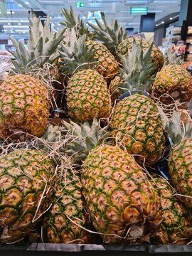 Pineapple fruit in the supermarket, picture for a background for pineapple lovers. 