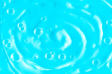 Bubble light blue background texture. Berry gel to cleanse the skin of the face and body. Spa treatments, skin care. Bath foam, detergent. Slime blue