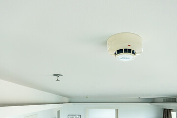 smoke detector and fire sprinkler on ceiling, fire alarming system and security system at home property for safety domestic life - obrazy, fototapety, plakaty