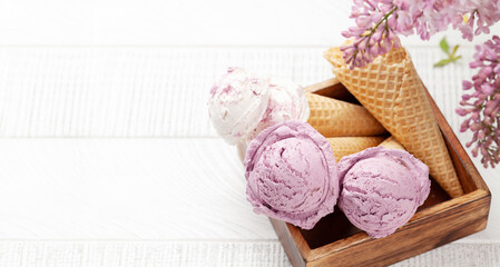Fototapeta na wymiar Berry ice cream in waffle cones