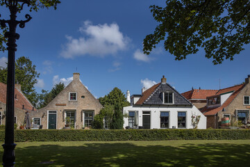 Fototapeta na wymiar Houses. Street. Village at Schiermonnikoog waddeneiland. Netherlands. Waddenzee. Coast