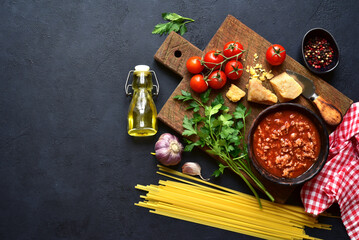 Traditional italian sauce bolognese from minced meat and tomatoes. Top view with copy space.