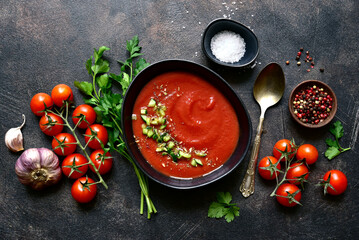 Gazpacho - cold spanish tomato soup with cucumber. Top view with copy space.