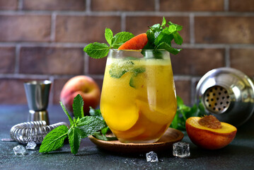 Summer peach cocktail with mint.
