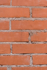 Obraz premium Red or brown brick vertical wall texture old stone background