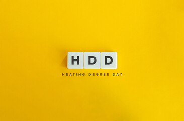 Heating Degree Day (HDD) Banner. Letter Tiles on Yellow Background. Minimal Aesthetics.