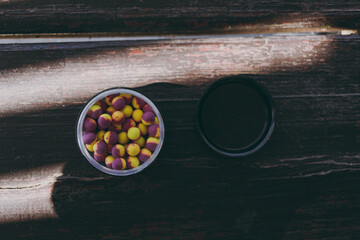 Fish food in the form of bright balls