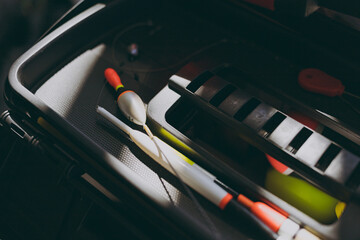 Fishing floats and tackle in a box © Tetiana Romaniuk