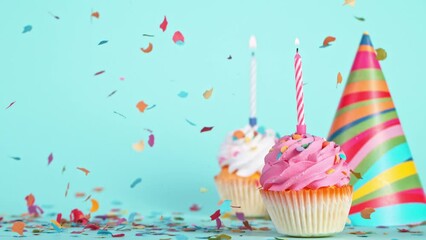 Birthday Cup Cakes With Burning Colorful Candle on Pastel Blue Background. Super Slow Motion, 1000 FPS.