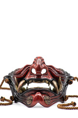 Isolated photos of a samurai mask in the form of a demon oni