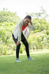 Woman gets heatstroke, Sport woman gets in pink sport shirt Dizzy and Faint when she jogging or...
