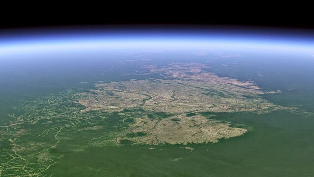 Deforestation of the Amazonia. View from space over the Amazon region. On a green background, huge bald patches of cut down forests are visible