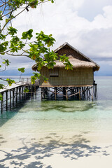 Fototapeta premium Hut on remote Island in a lagoon 